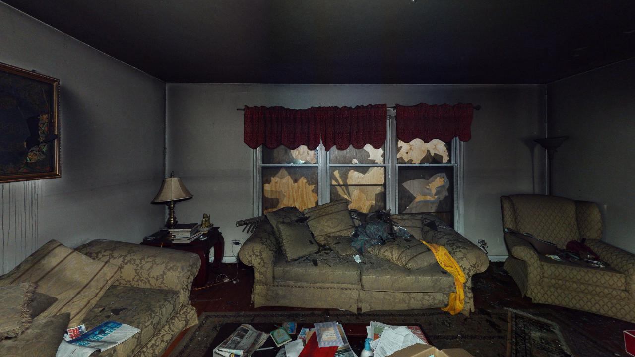 A living room filled with furniture and a couch.