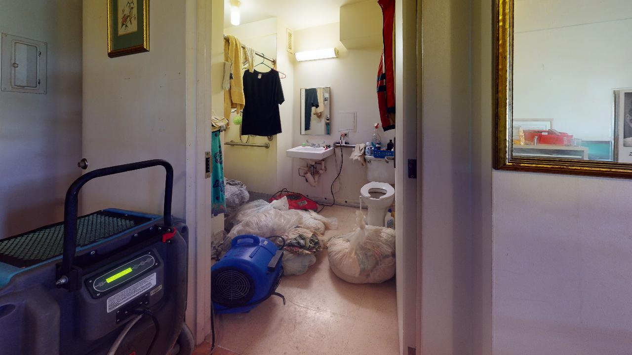 A bathroom with a sink , toilet , and mirror.