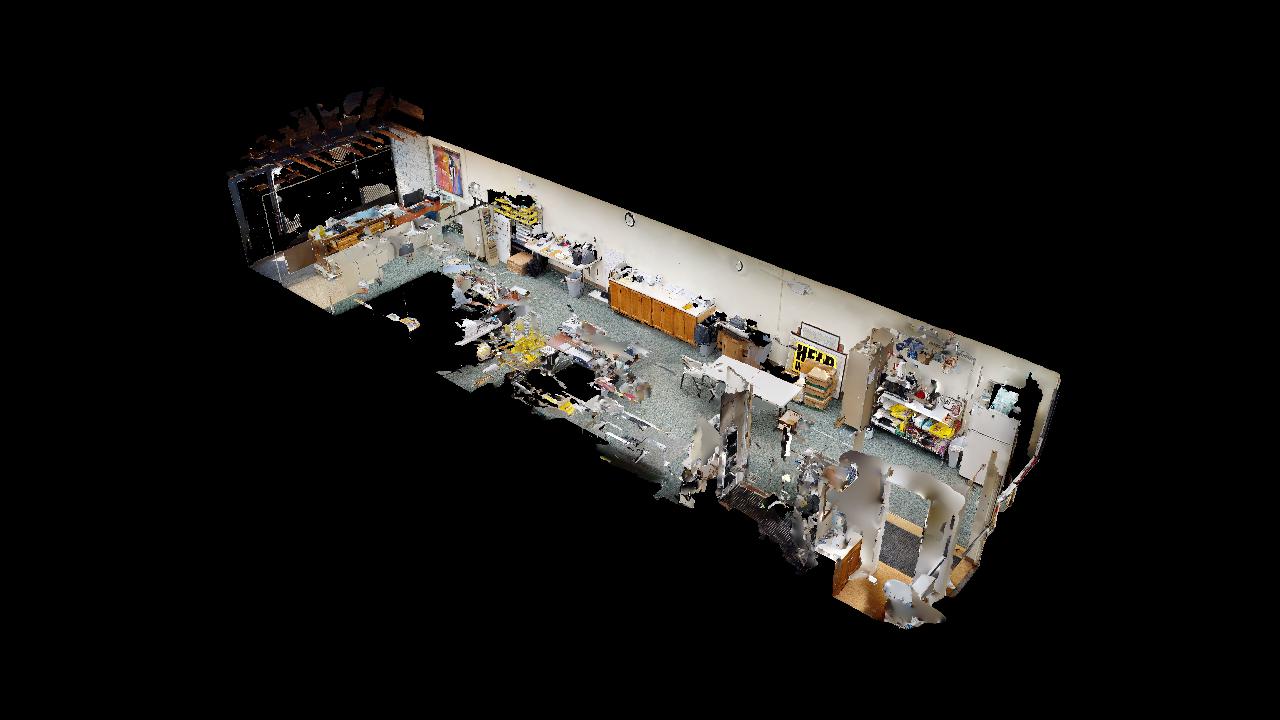 An aerial view of a room with a lot of furniture and a black background.