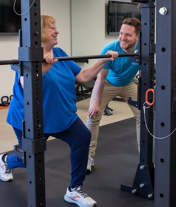 older woman being coached by a personal trainer at core principles personal training in stamford connecticut