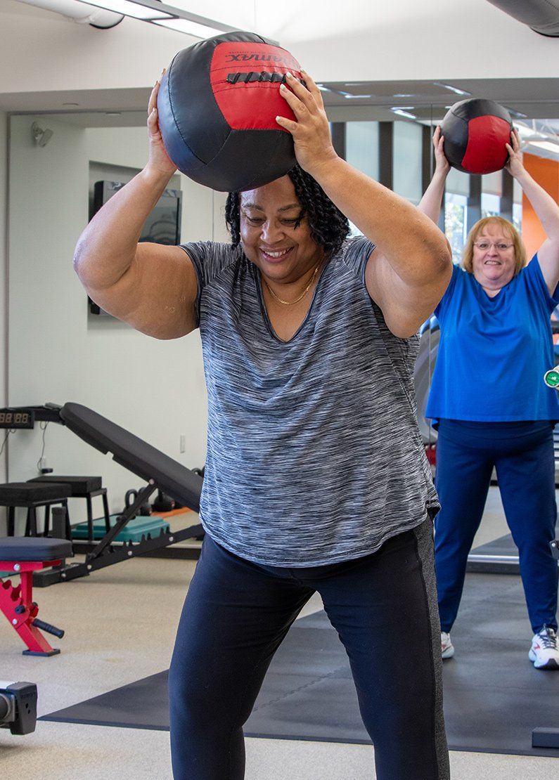 two older women exercising together at core principles personal training in stamford connecticut