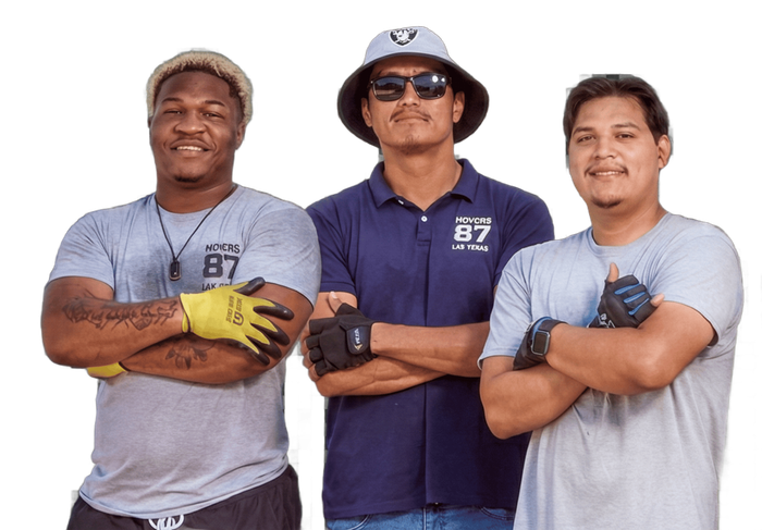 Three individuals with folded arms wear work gloves and shirts featuring the number 87 against a white background.