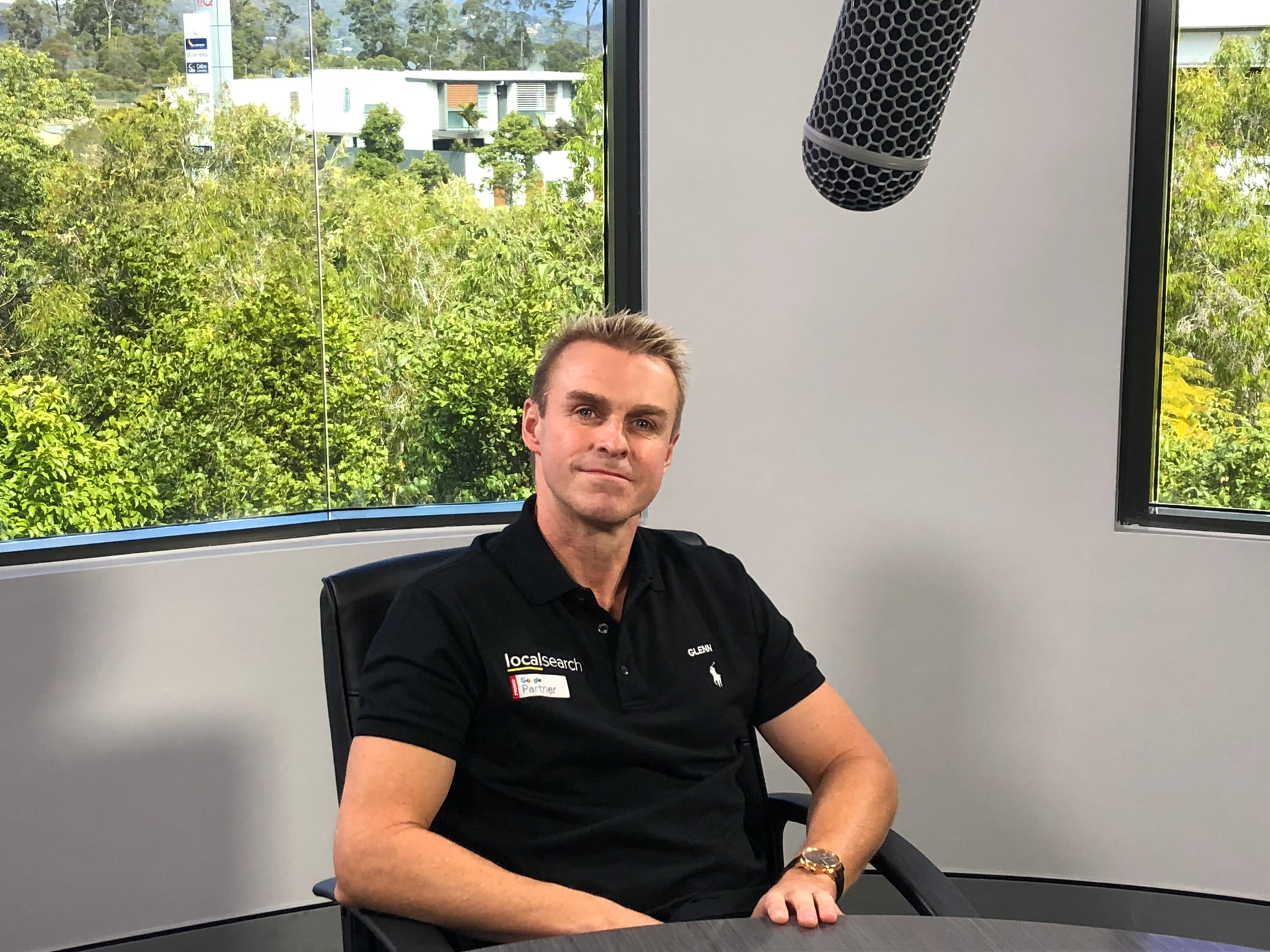 A Man Is Sitting On A Balcony Overlooking The Ocean - Entrepreneur on the Gold Coast, QLD