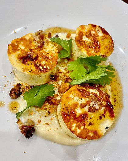 Halloumi scallops with cauliflower puree, dukkha & beurre noisette
