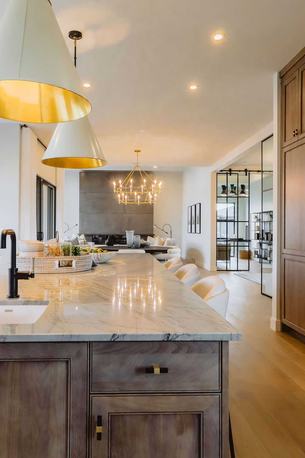 A kitchen with a large island and a sink.