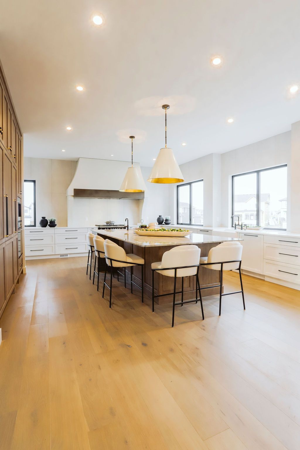 There is a large island in the middle of the kitchen.