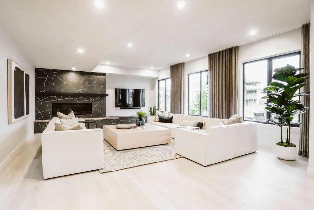 A living room filled with furniture and a fireplace.