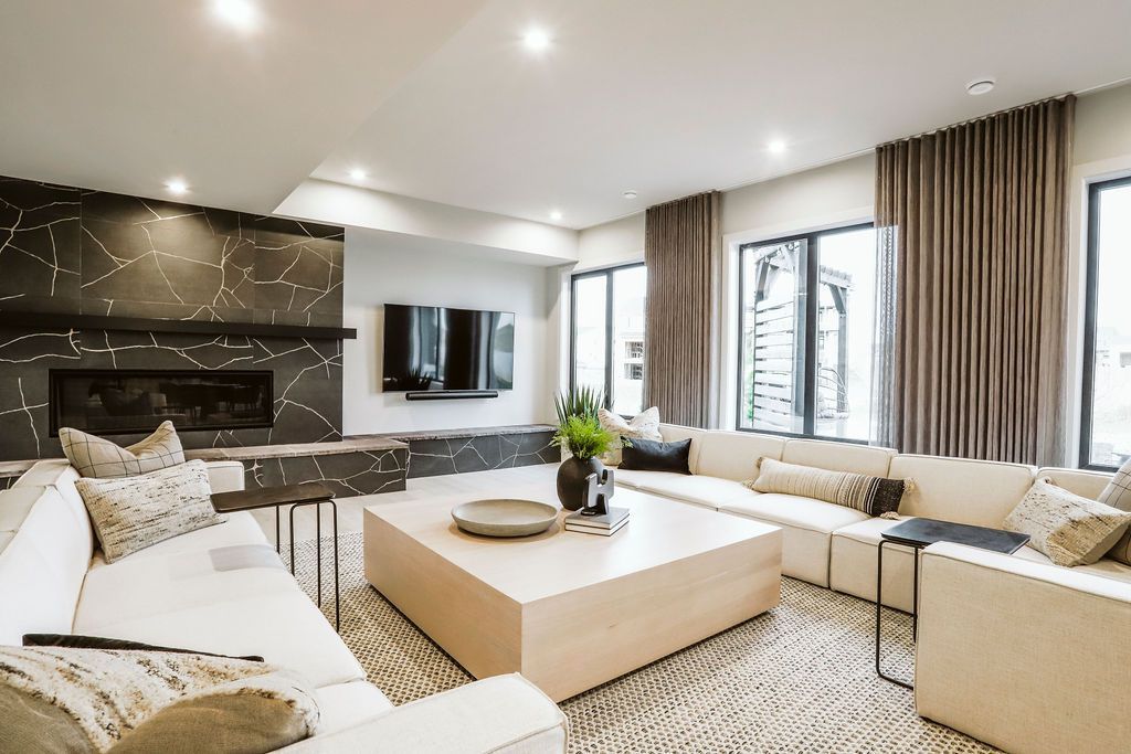 A living room filled with furniture and a fireplace.