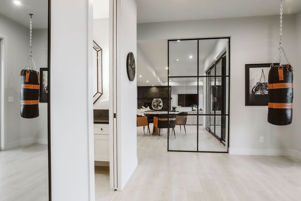 A boxing bag is hanging from the ceiling in a room.