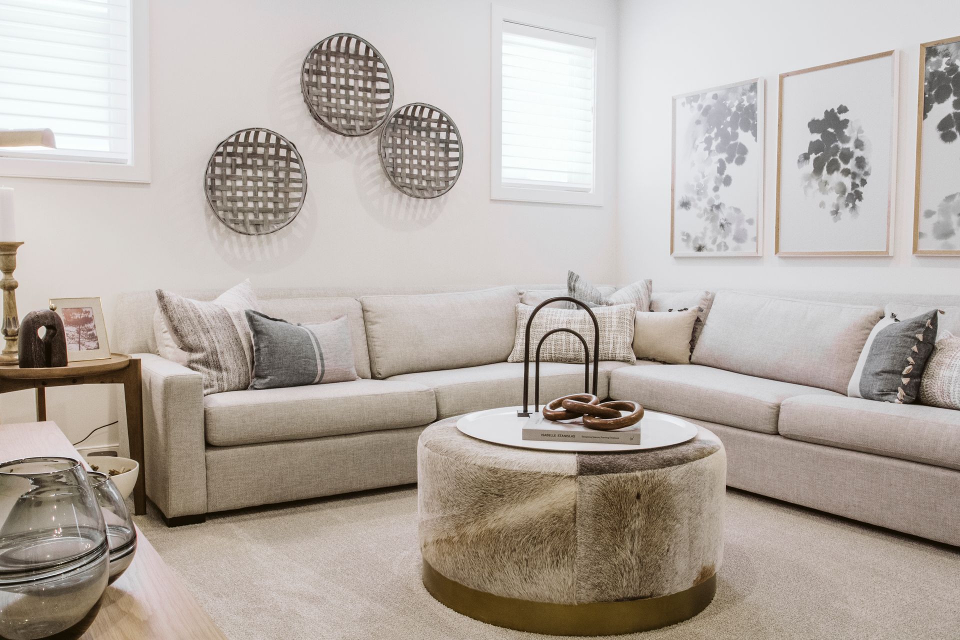 A living room with two couches and a round coffee table.