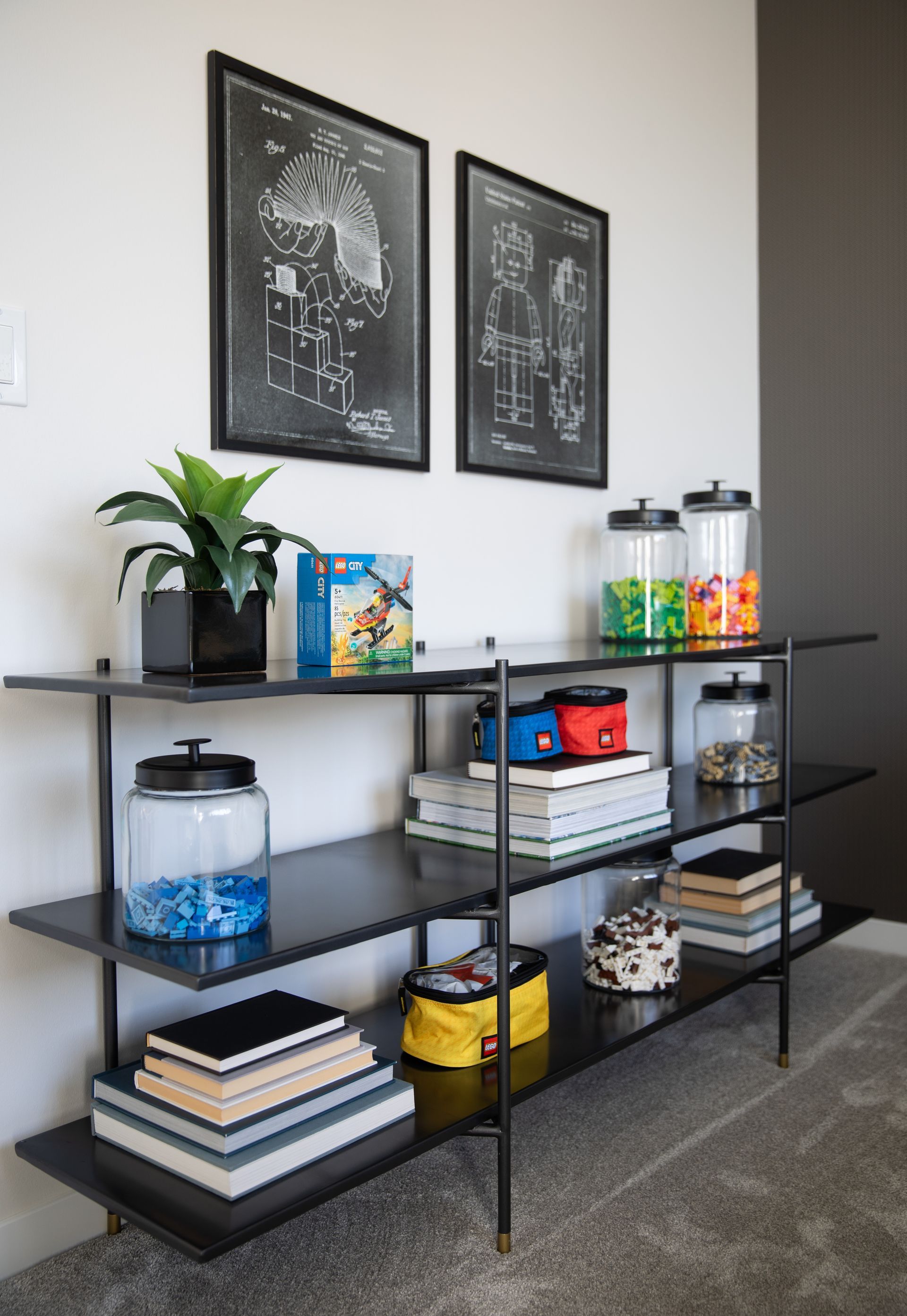A room with a shelf filled with books and jars of candy.