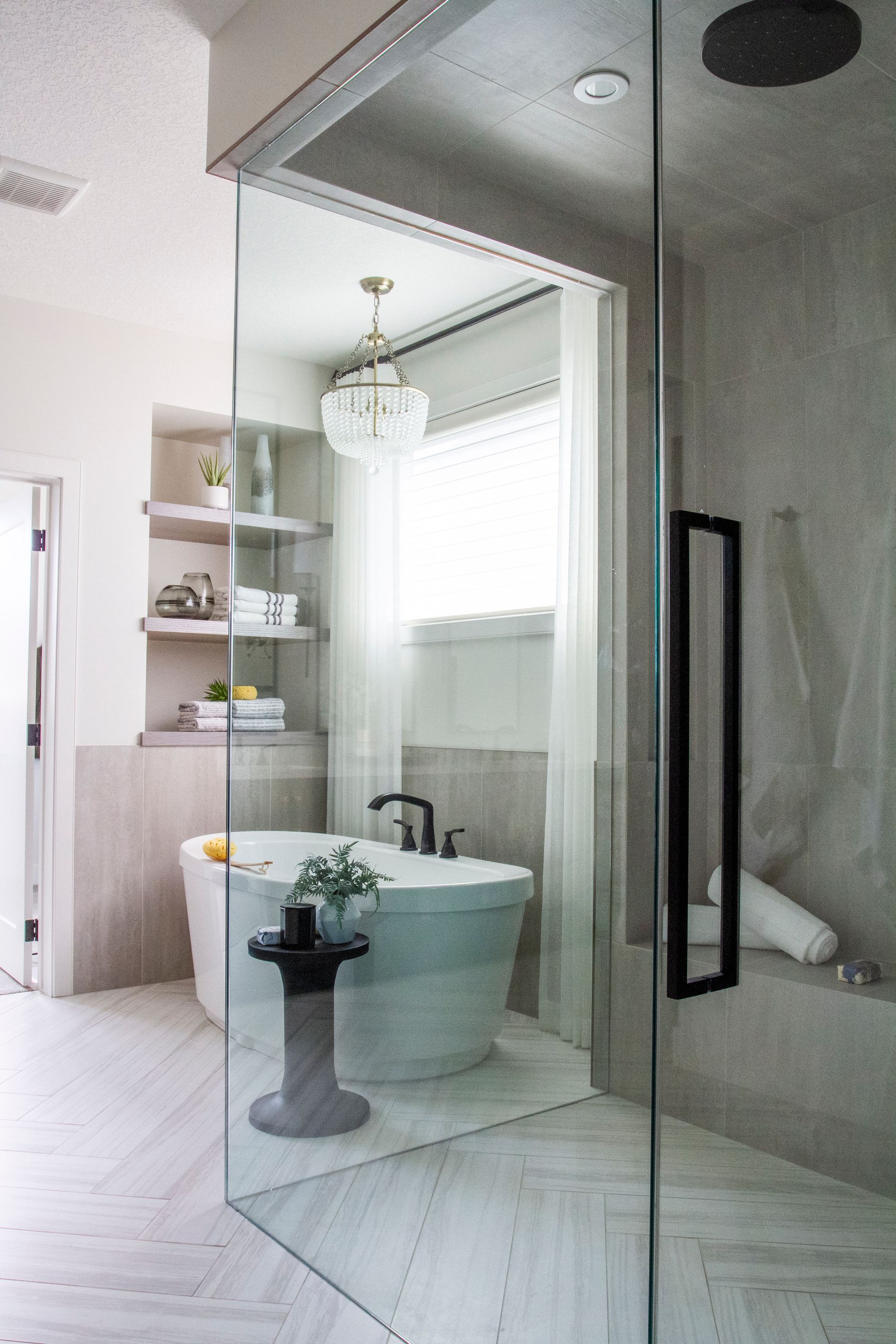 A bathroom with a bathtub and a walk in shower.