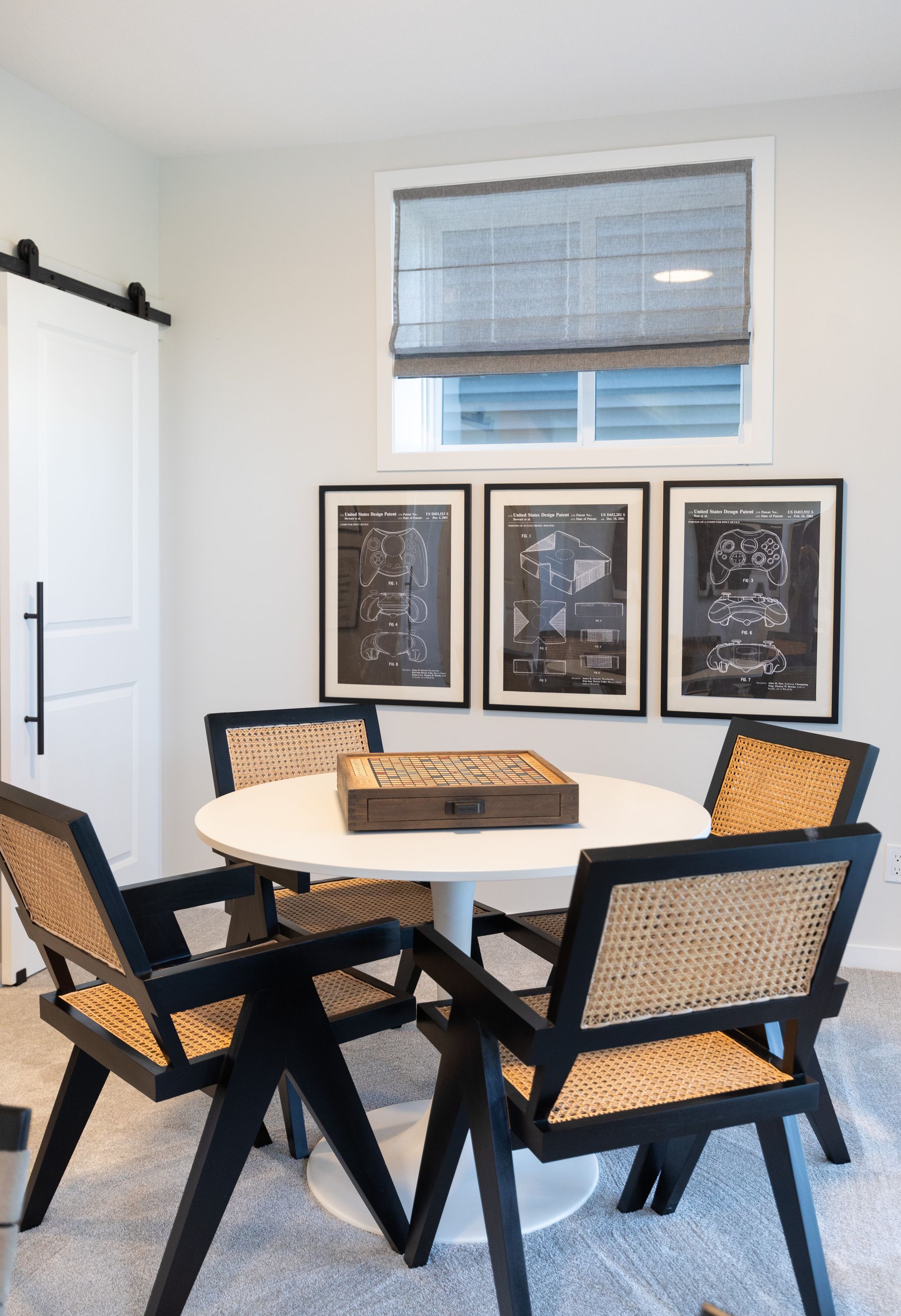 There is a table and chairs in the room.