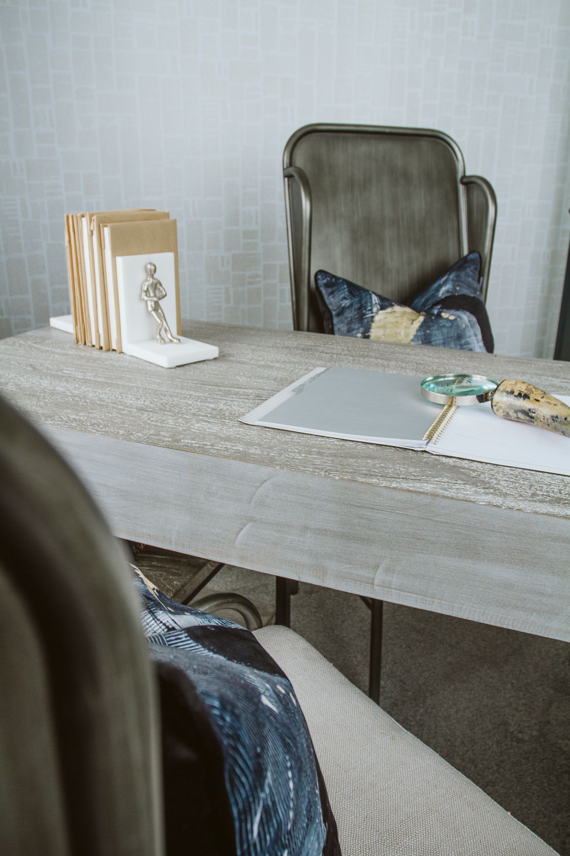 A person is sitting at a table with a laptop on it.
