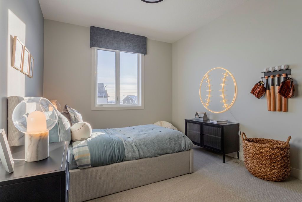 A bedroom with a bed , nightstand , and window.