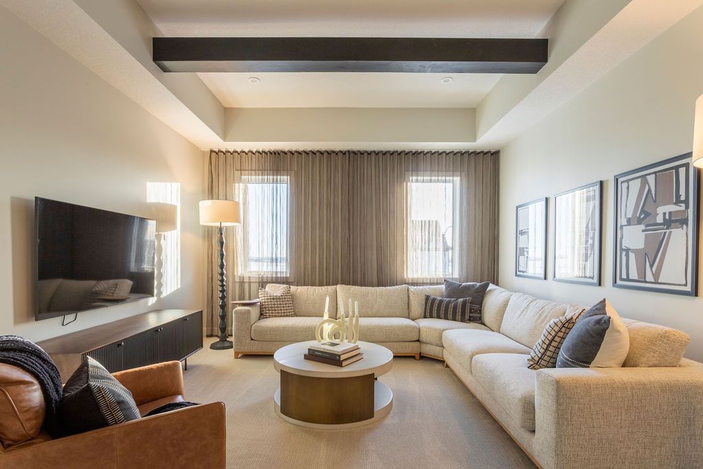 A living room filled with furniture and a flat screen tv.