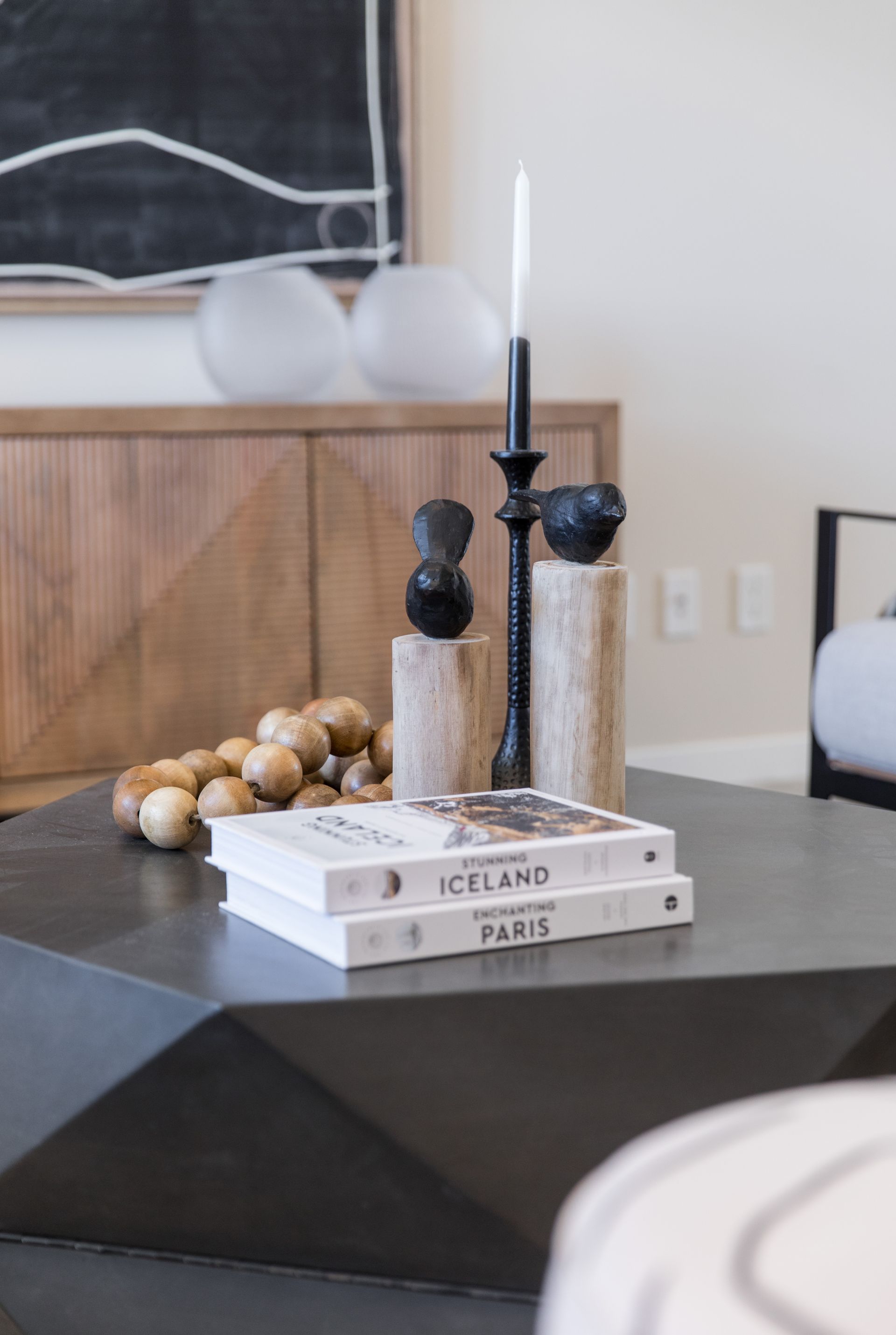 A living room with a coffee table and two books on it