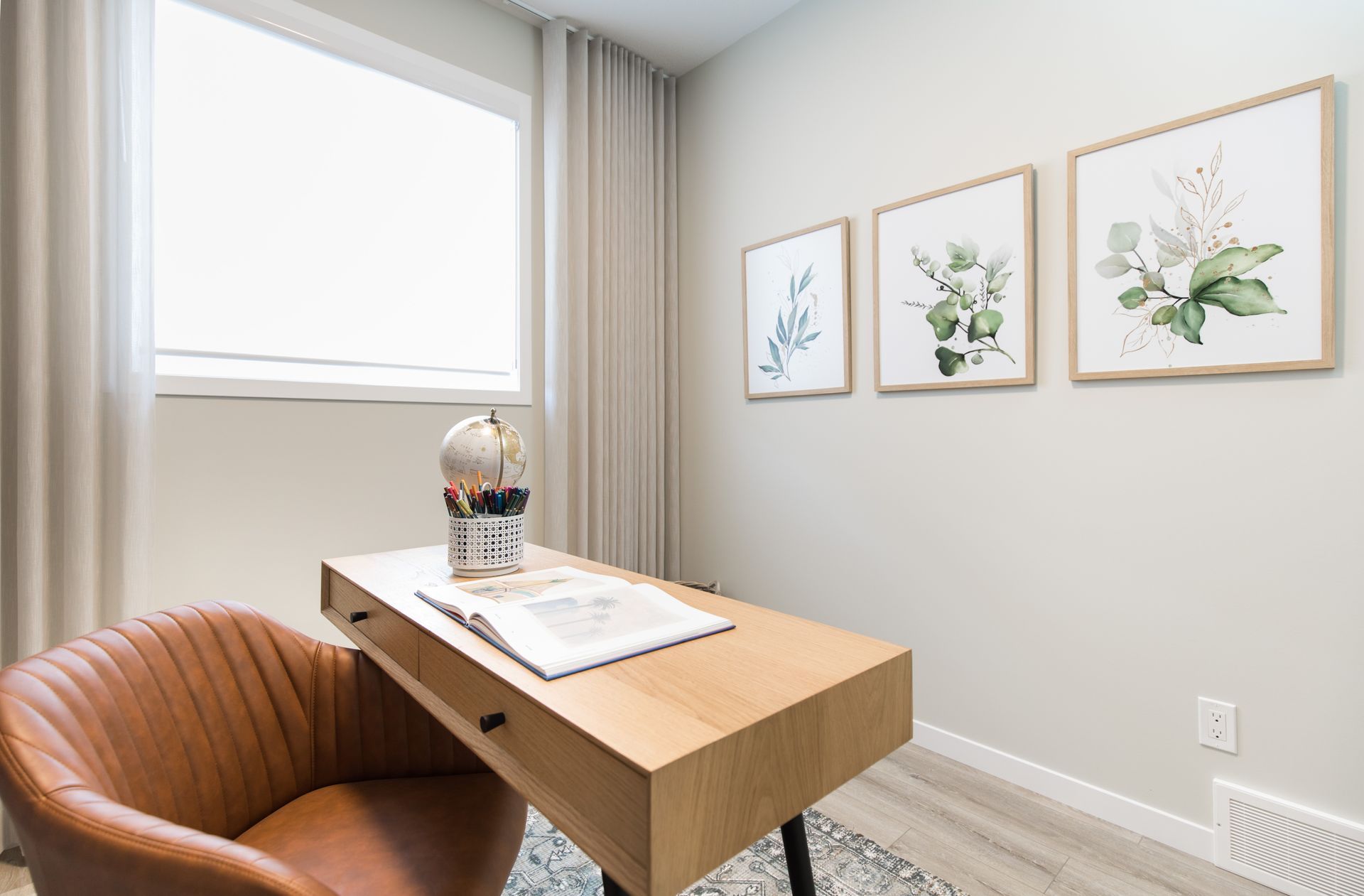 There is a desk and chair in the room.