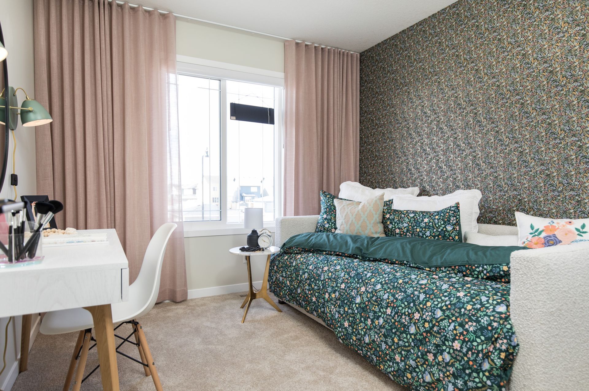 A bedroom with a bed , desk , chair and window.