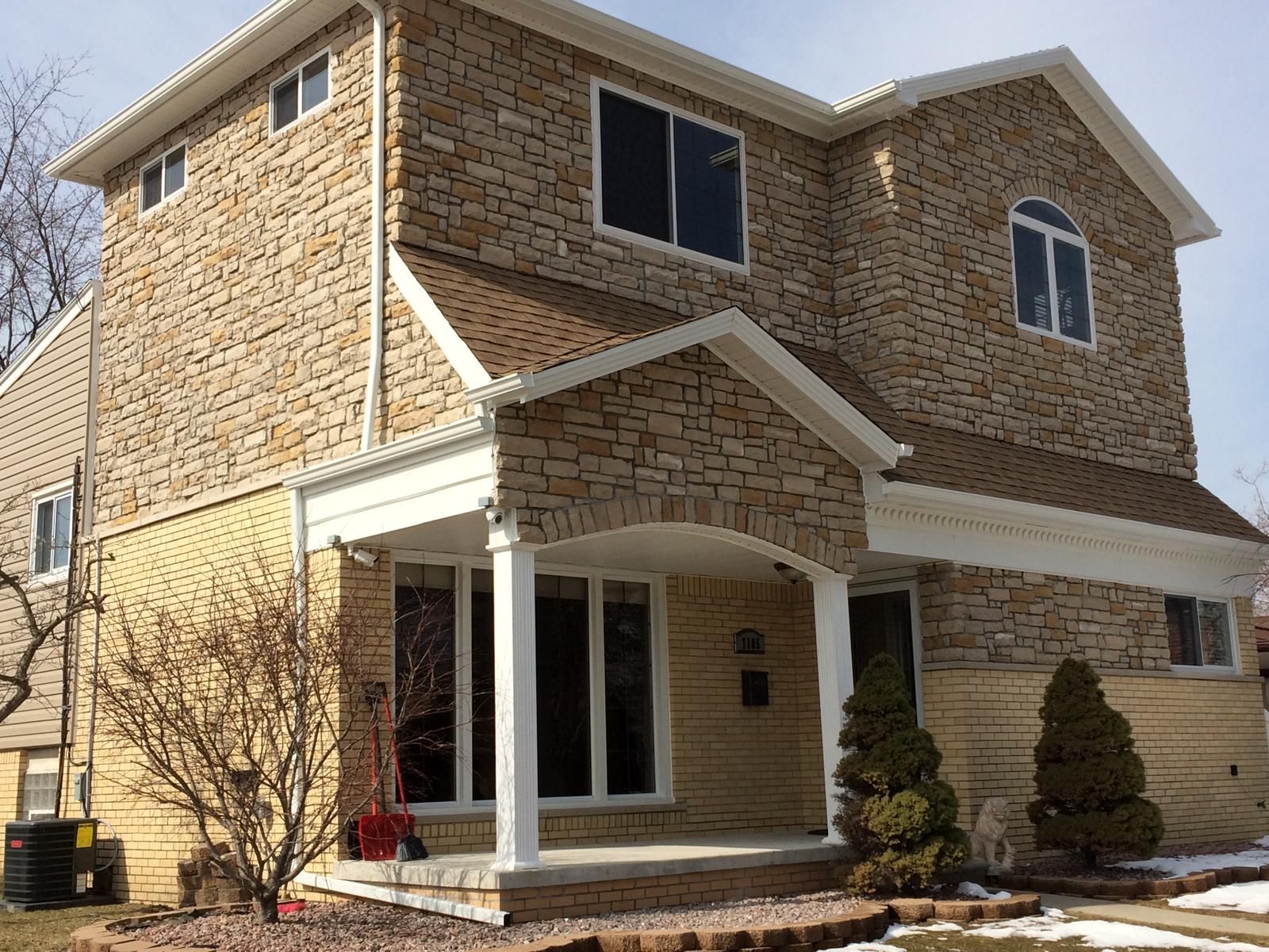 A bathroom with a bathtub , toilet , sink and mirror.