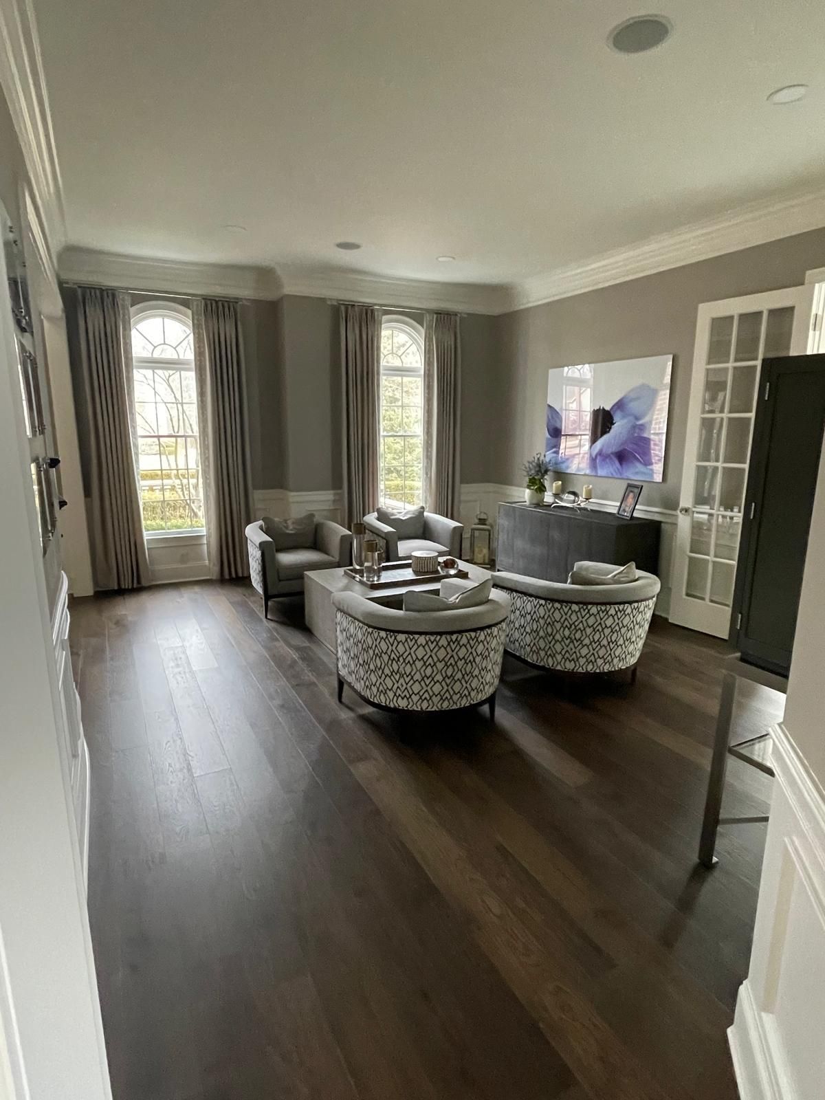 A living room filled with furniture and a television.