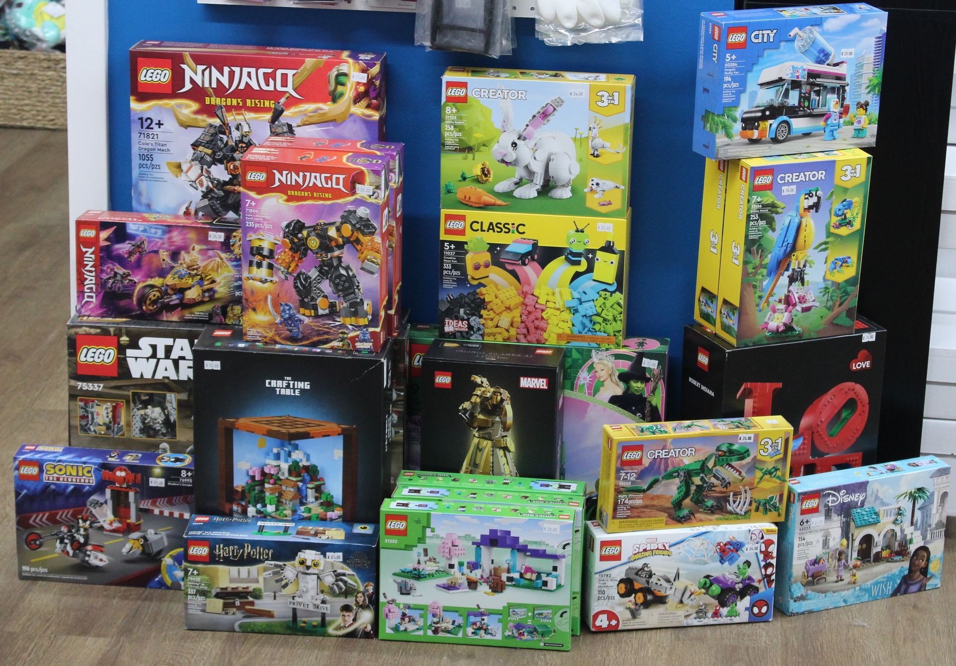 A lego logo next to a marvel super heroes logo