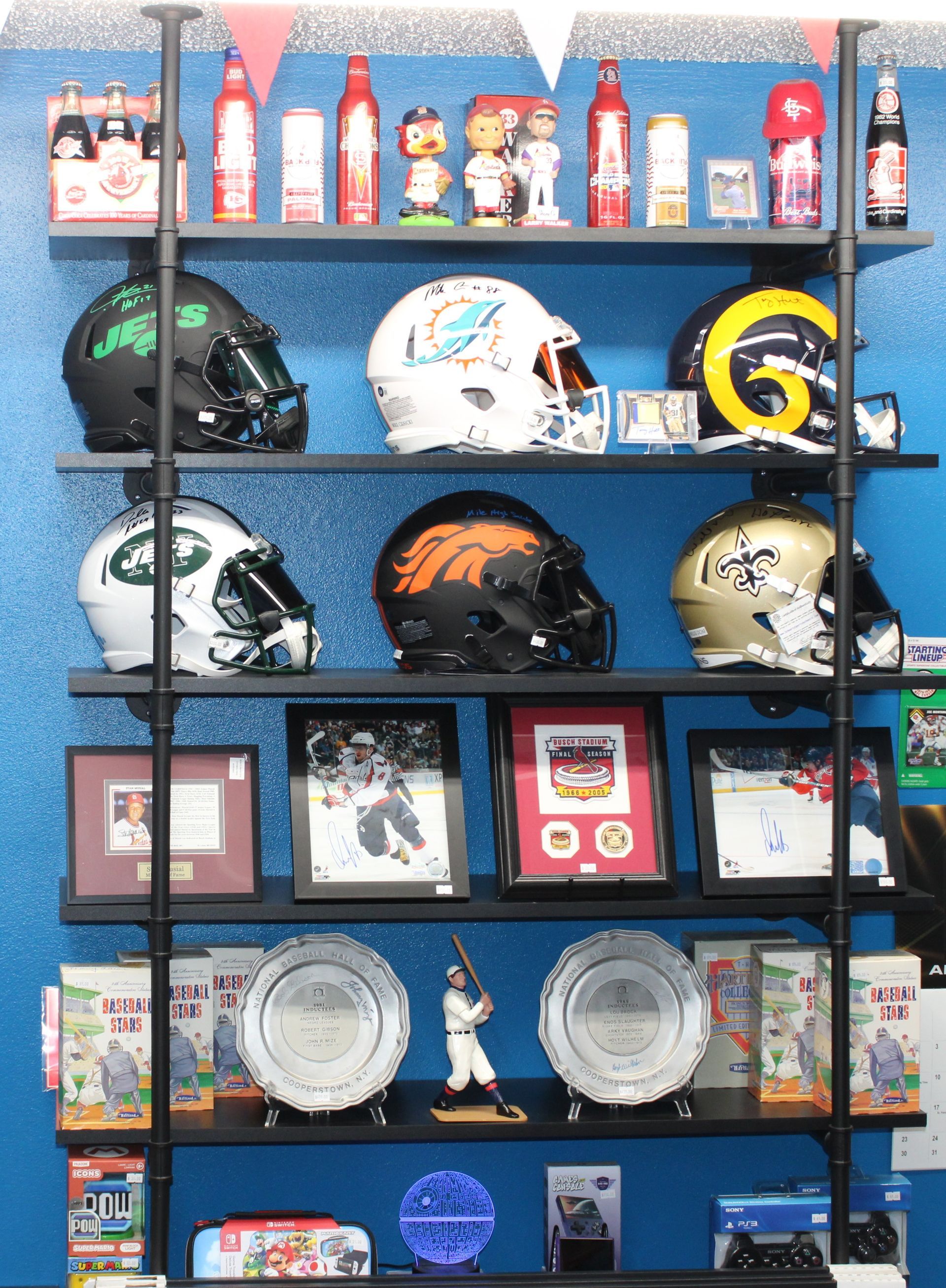 A baseball card with four players on it is in a case.