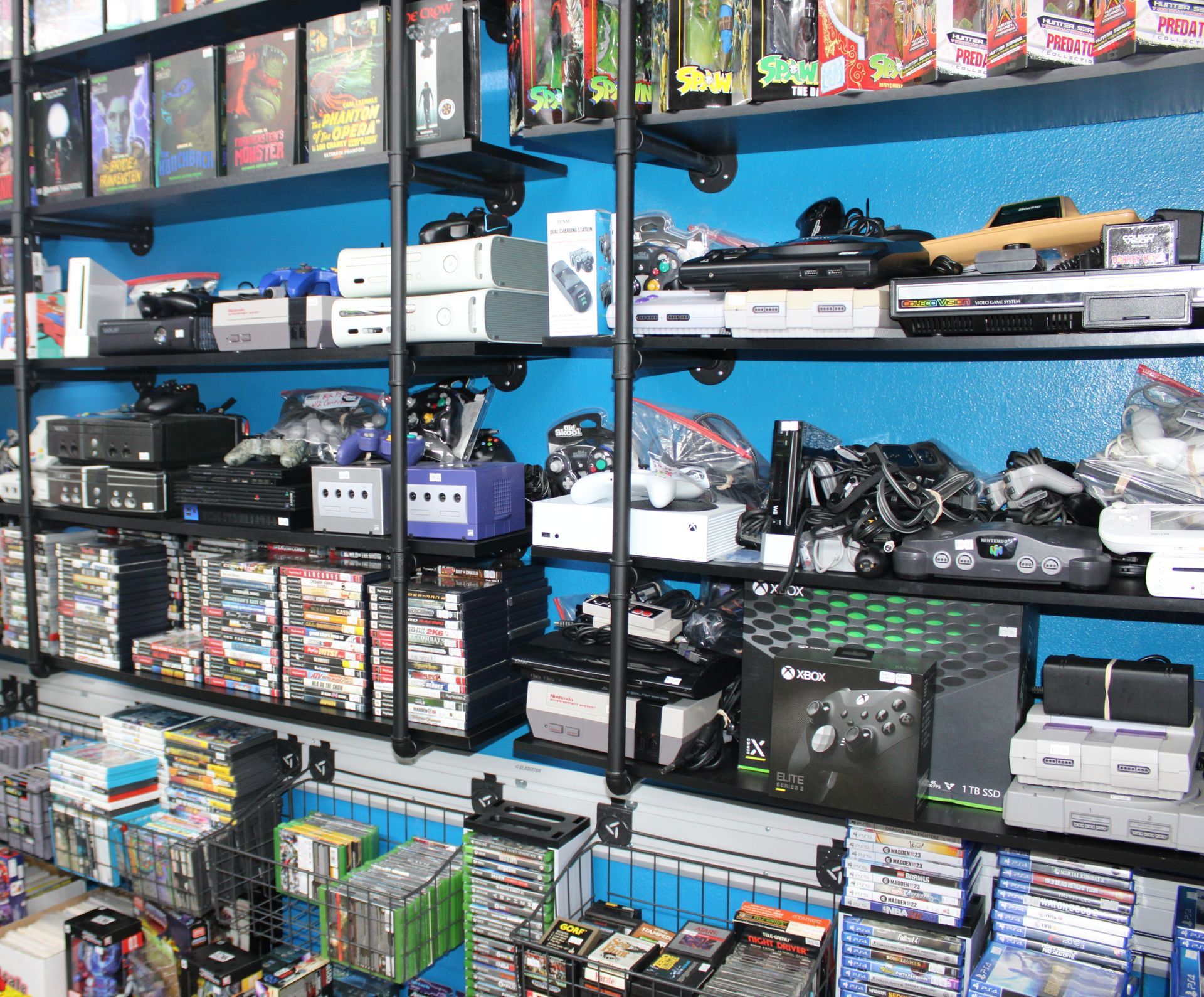 A room filled with lots of toys and a guardians of the galaxy poster on the wall.