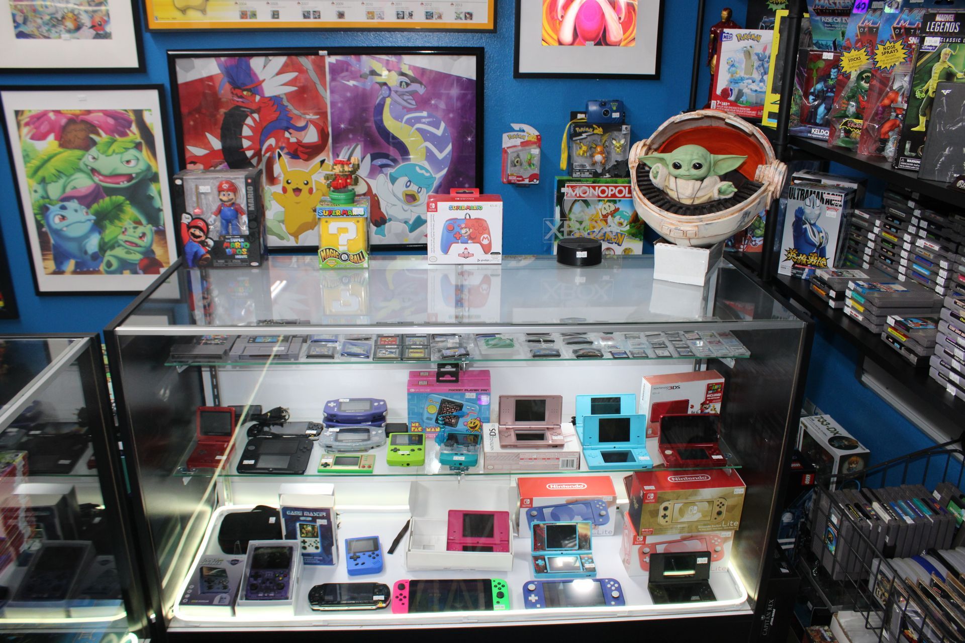 A shelf filled with lots of lego toys in a store.