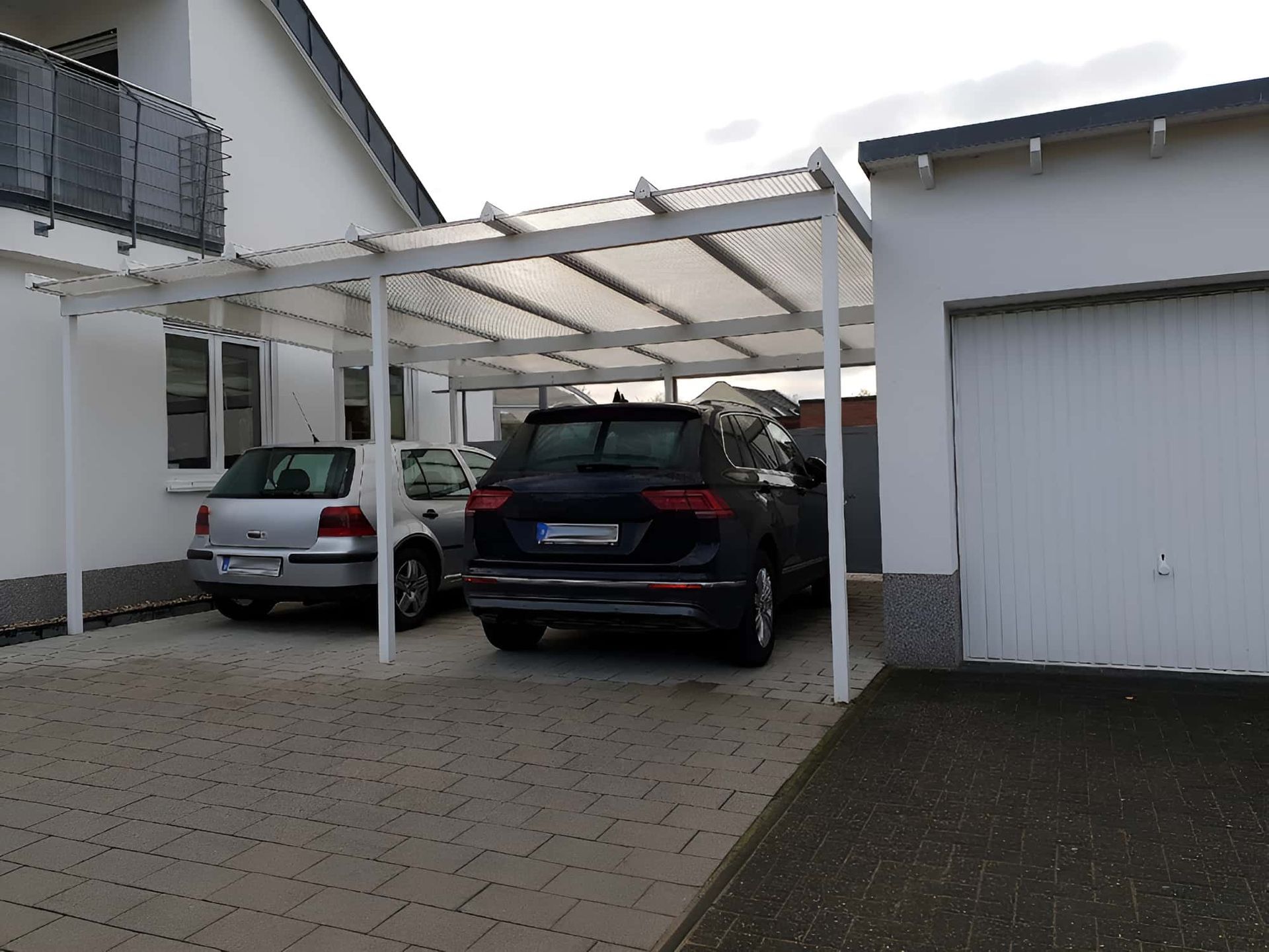 Two Cars Parked Under a Carport — Pride Carpentry & Maintenance In Berkeley Vale, NSW