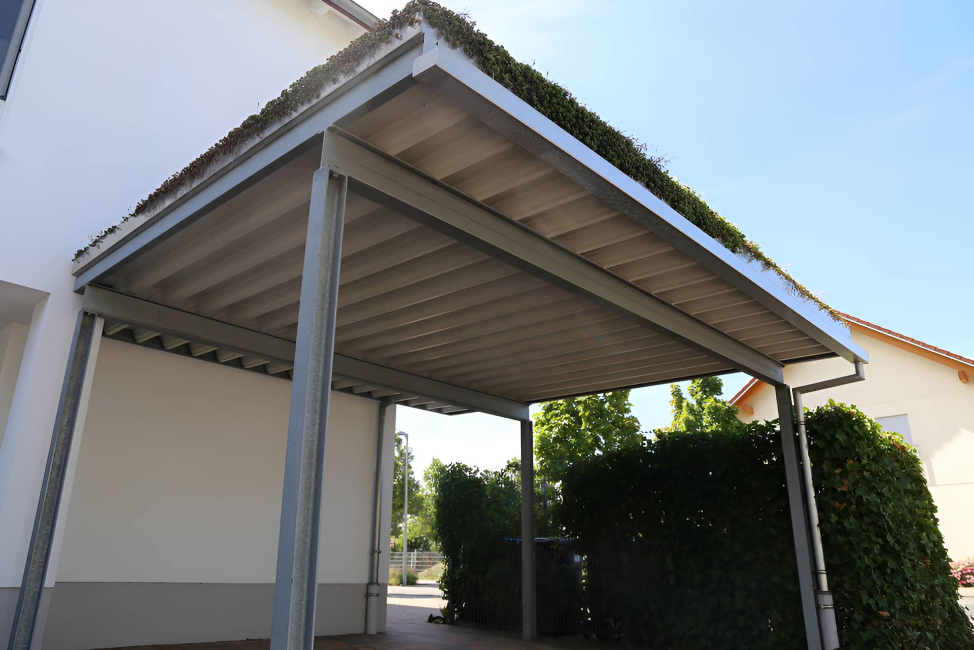 A Metal Carport Providing Shelter — Pride Carpentry & Maintenance In Berkeley Vale, NSW
