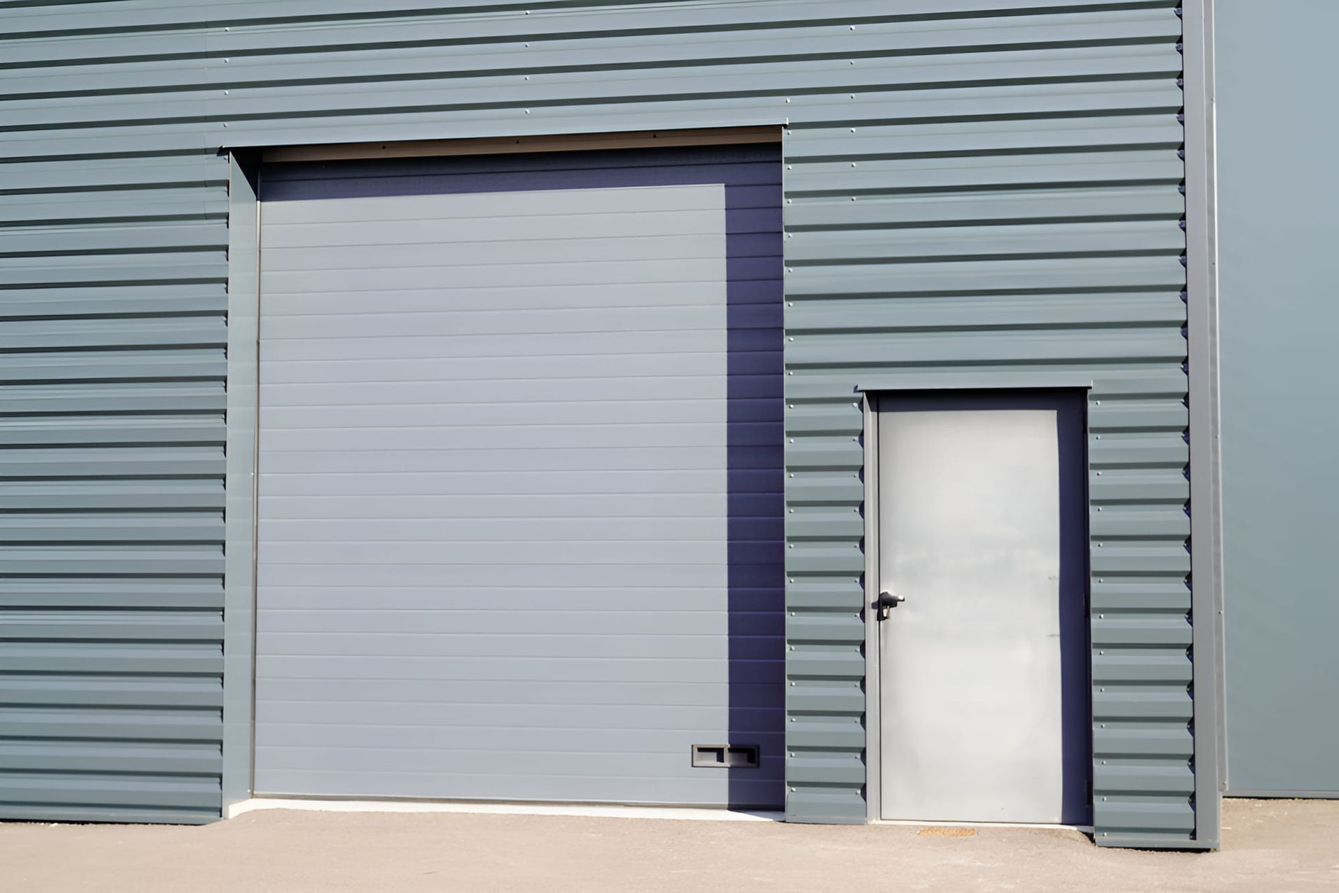 Building With a Blue Door — Pride Carpentry & Maintenance In Berkeley Vale, NSW