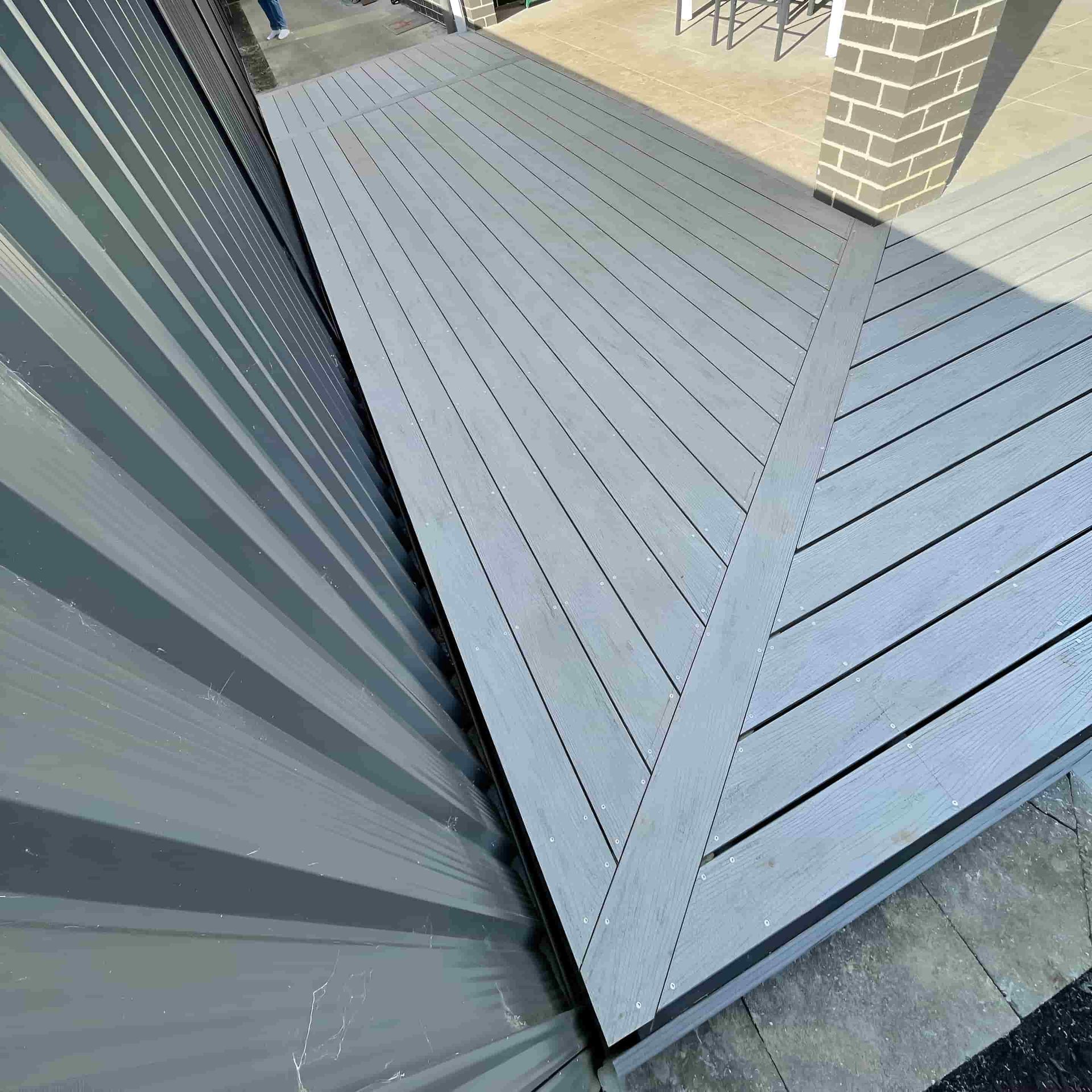 A Deck With a Roof Made of Wood — Pride Carpentry & Maintenance In Berkeley Vale, NSW