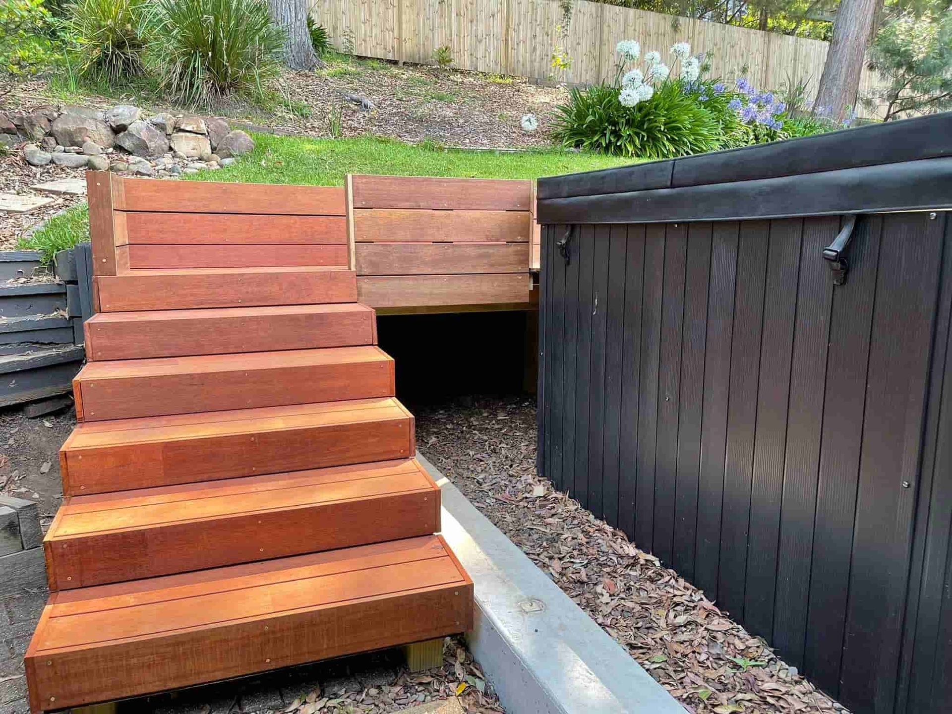 Wooden Staircase Leading Up to a Pool Area — Pride Carpentry & Maintenance In Berkeley Vale, NSW