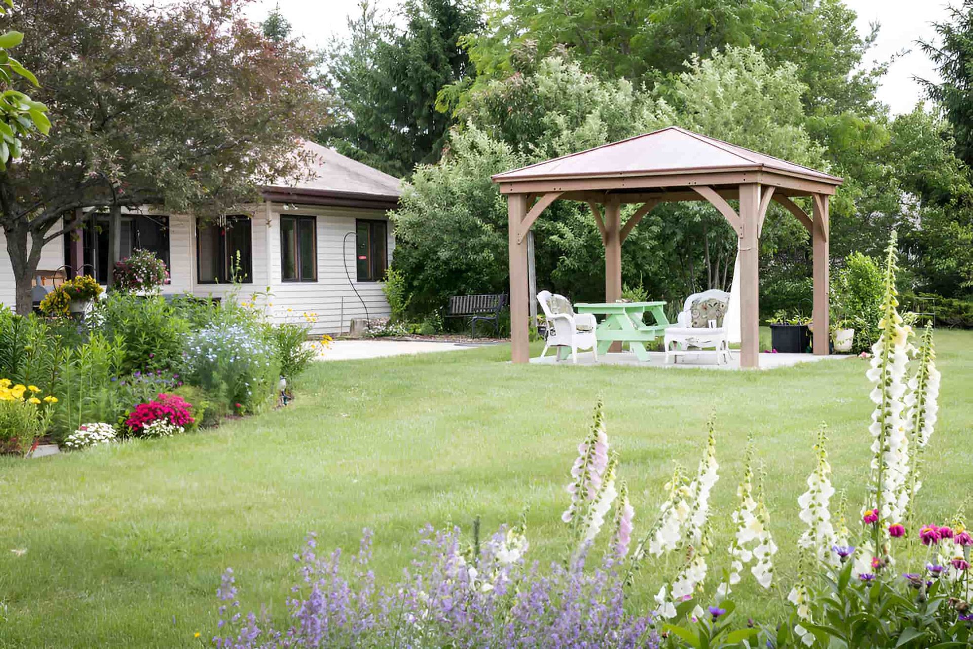 A Pergola in a Vibrant Yard With Grass — Pride Carpentry & Maintenance In Berkeley Vale, NSW