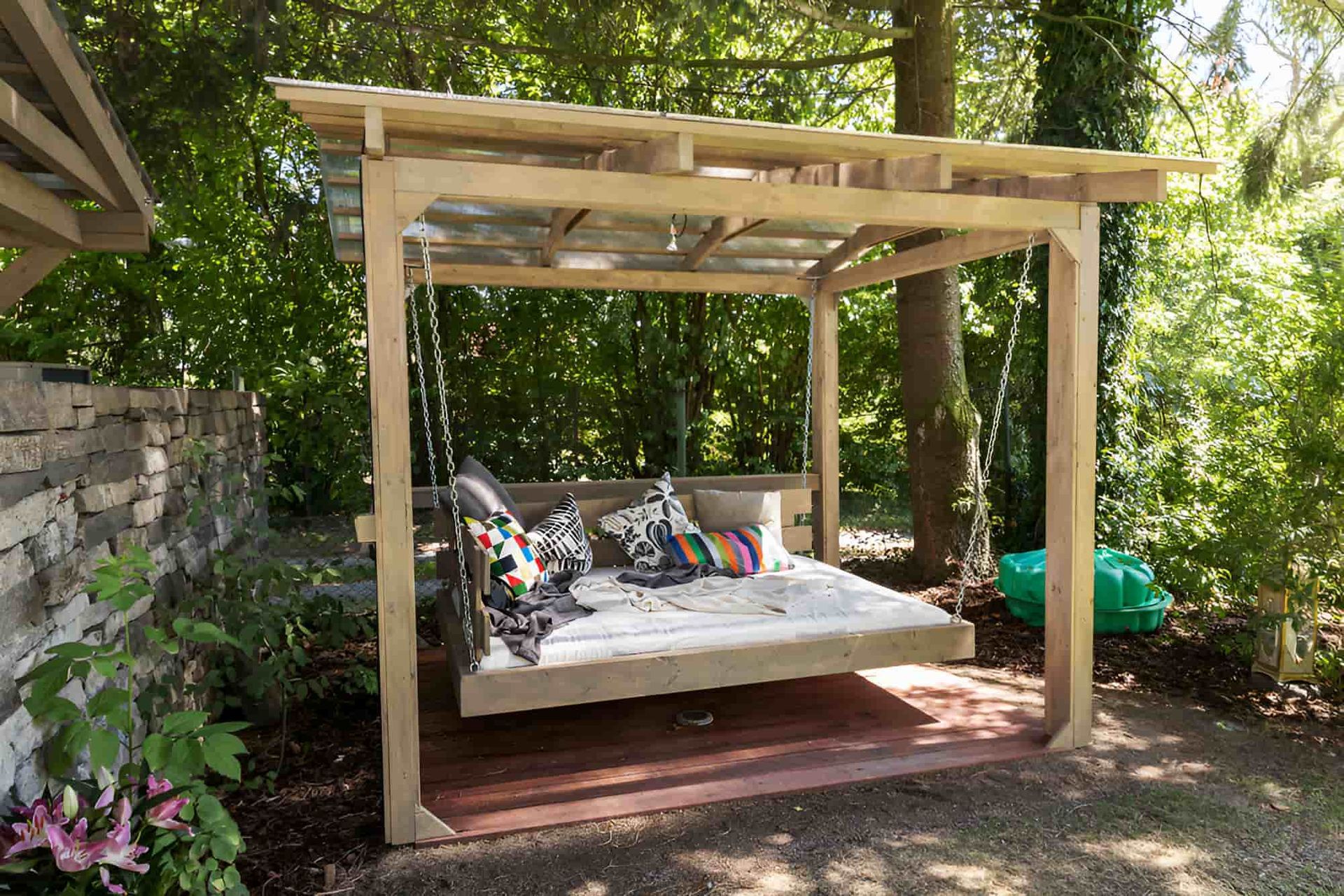 A Swing Bed Under a Pergola — Pride Carpentry & Maintenance In Berkeley Vale, NSW