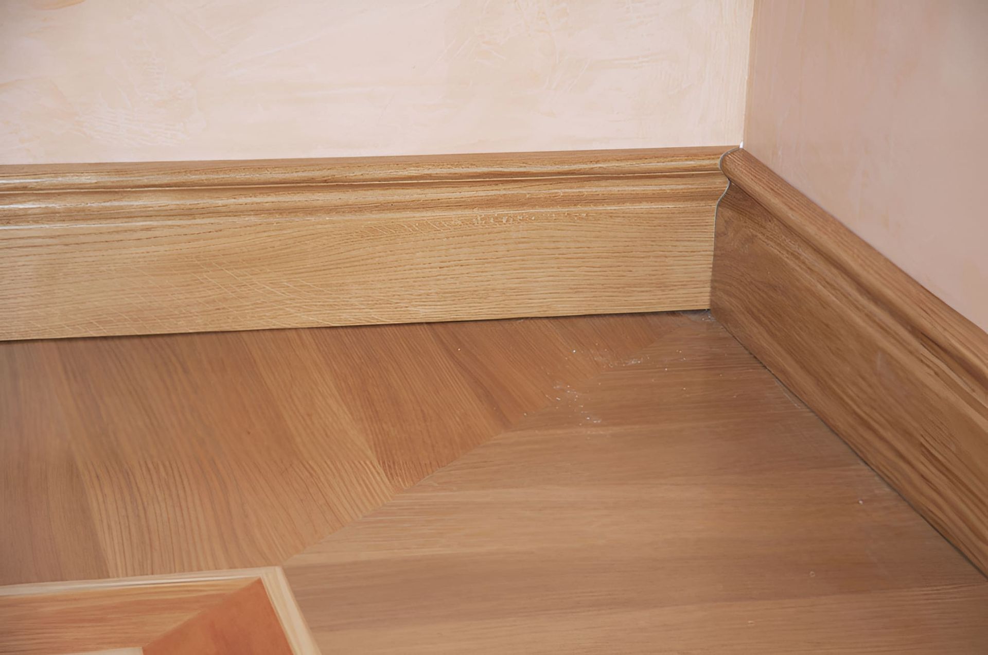 A Wooden Floor Corner Highlighting Its Surface and Edges — Pride Carpentry & Maintenance In Berkeley Vale, NSW