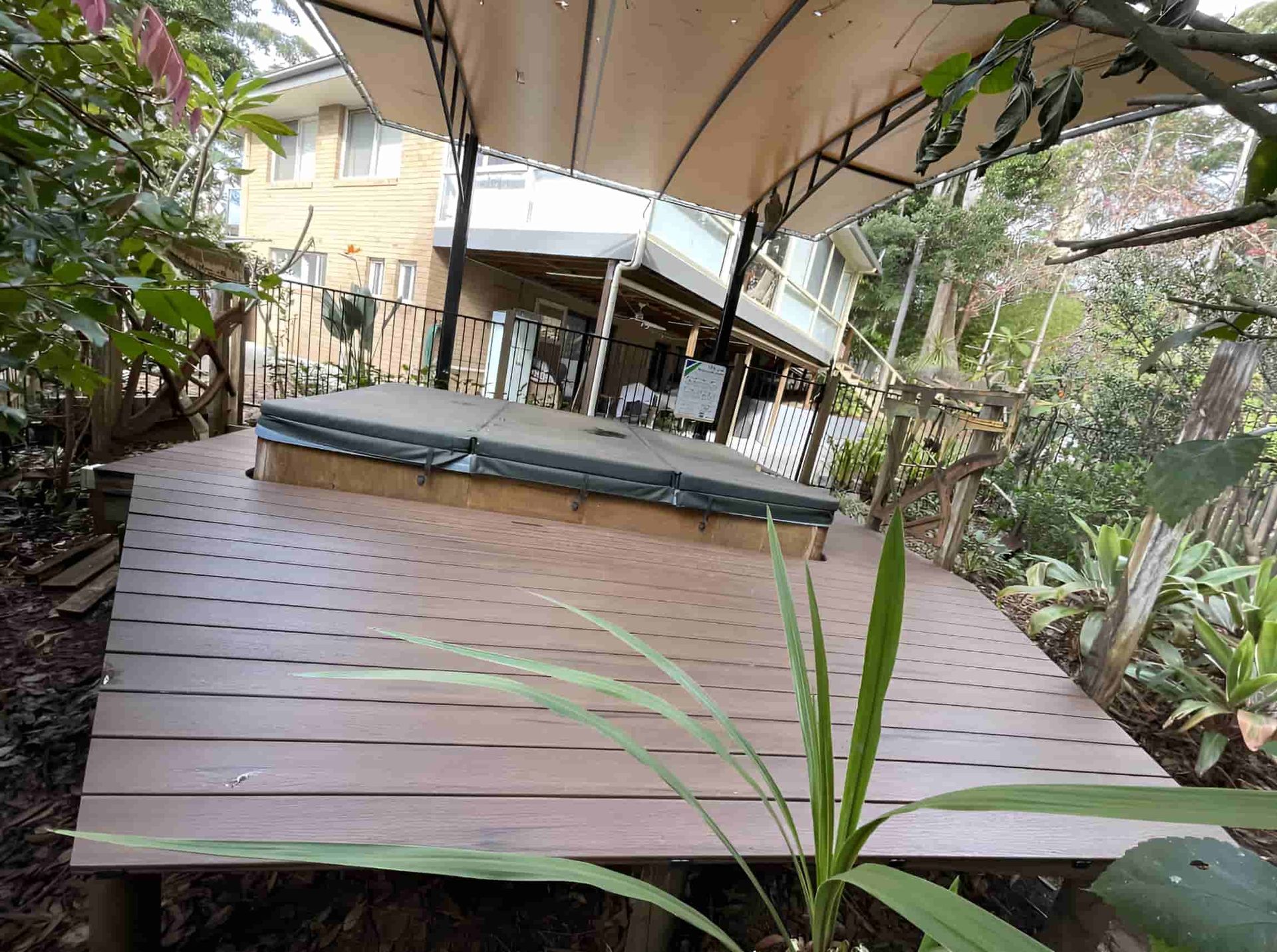 A Wooden Deck Featuring a Large Tub — Pride Carpentry & Maintenance In Berkeley Vale, NSW