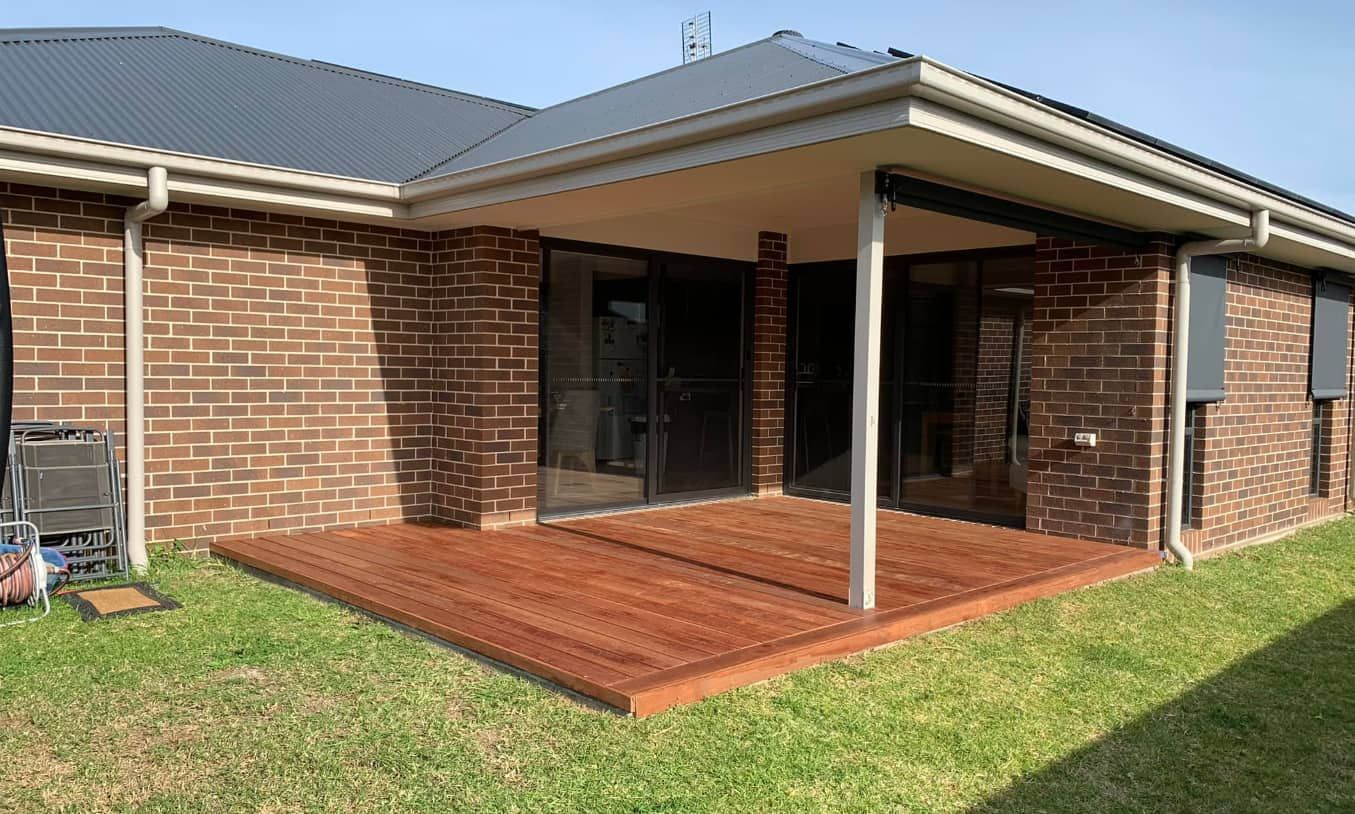 Brick House With a Wooden Deck — Pride Carpentry & Maintenance In Central Coast, NSW