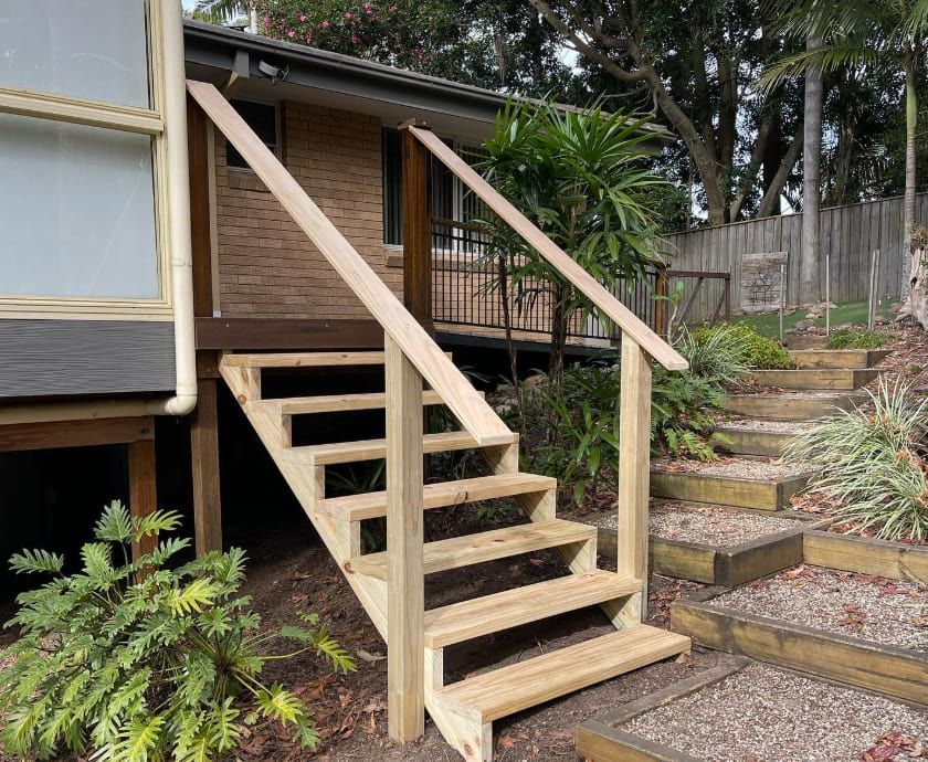 Wooden Staircase Leading Up to a House Entrance — Pride Carpentry & Maintenance In Berkeley Vale, NSW