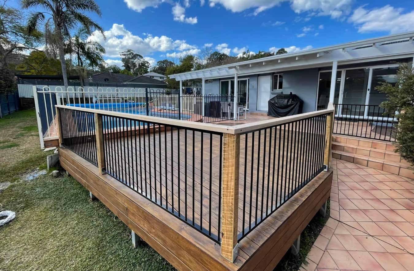 Deck With a Pool and Railing Made of Wood — Pride Carpentry & Maintenance In Lake Macquarie, NSW