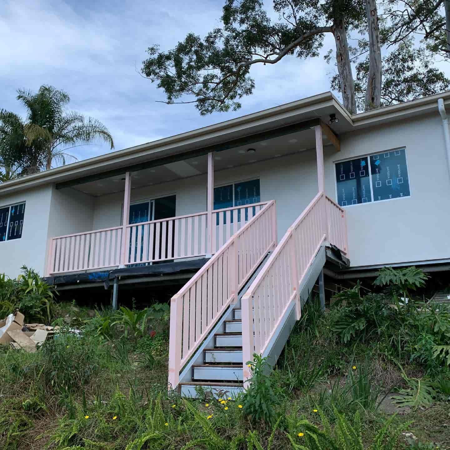 A House With Stairs and a Balcony — Pride Carpentry & Maintenance In Berkeley Vale, NSW
