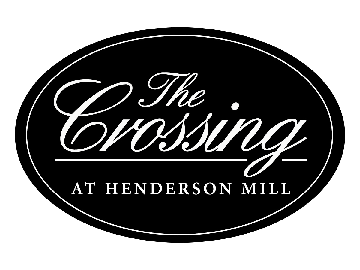 Logo for The Crossing at Henderson Mill in light gray inside an oval outline