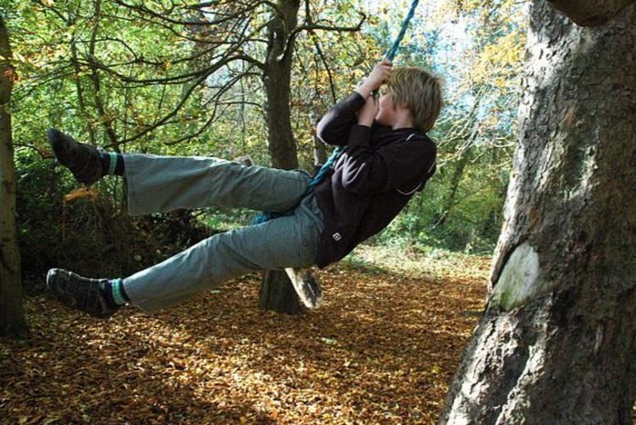 Person swinging on a rope