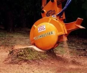 A large orange stump grinder