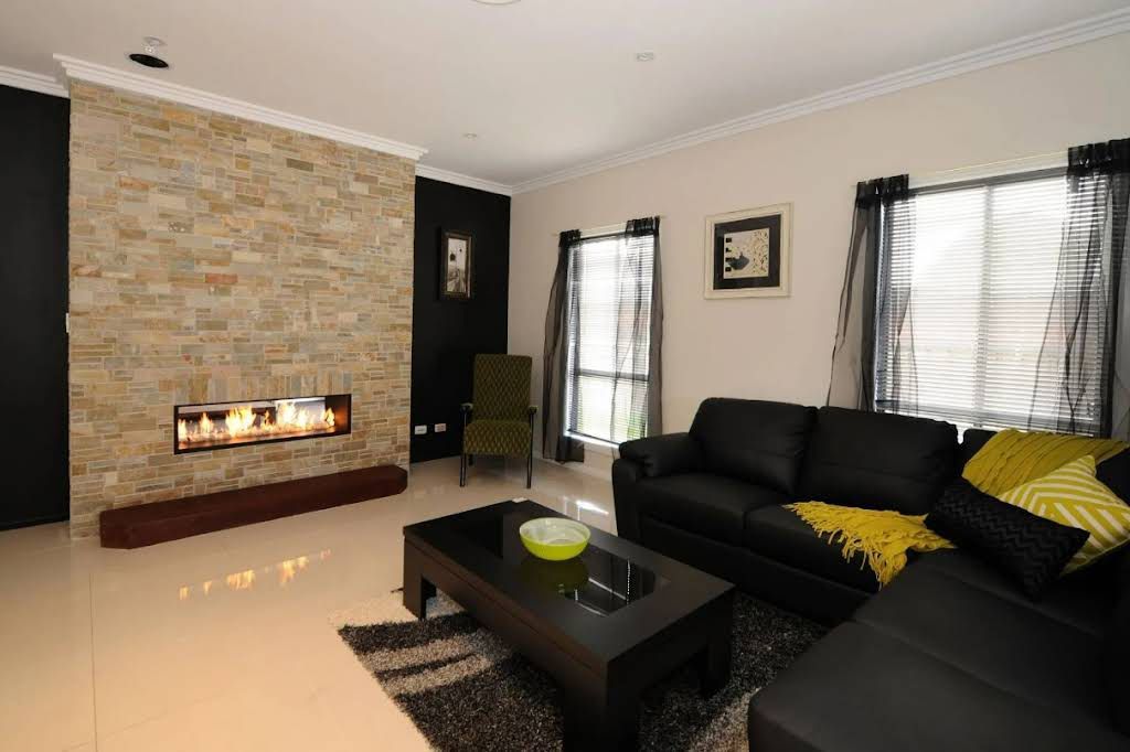New Home Living Room with Brick Walls and Fireplace