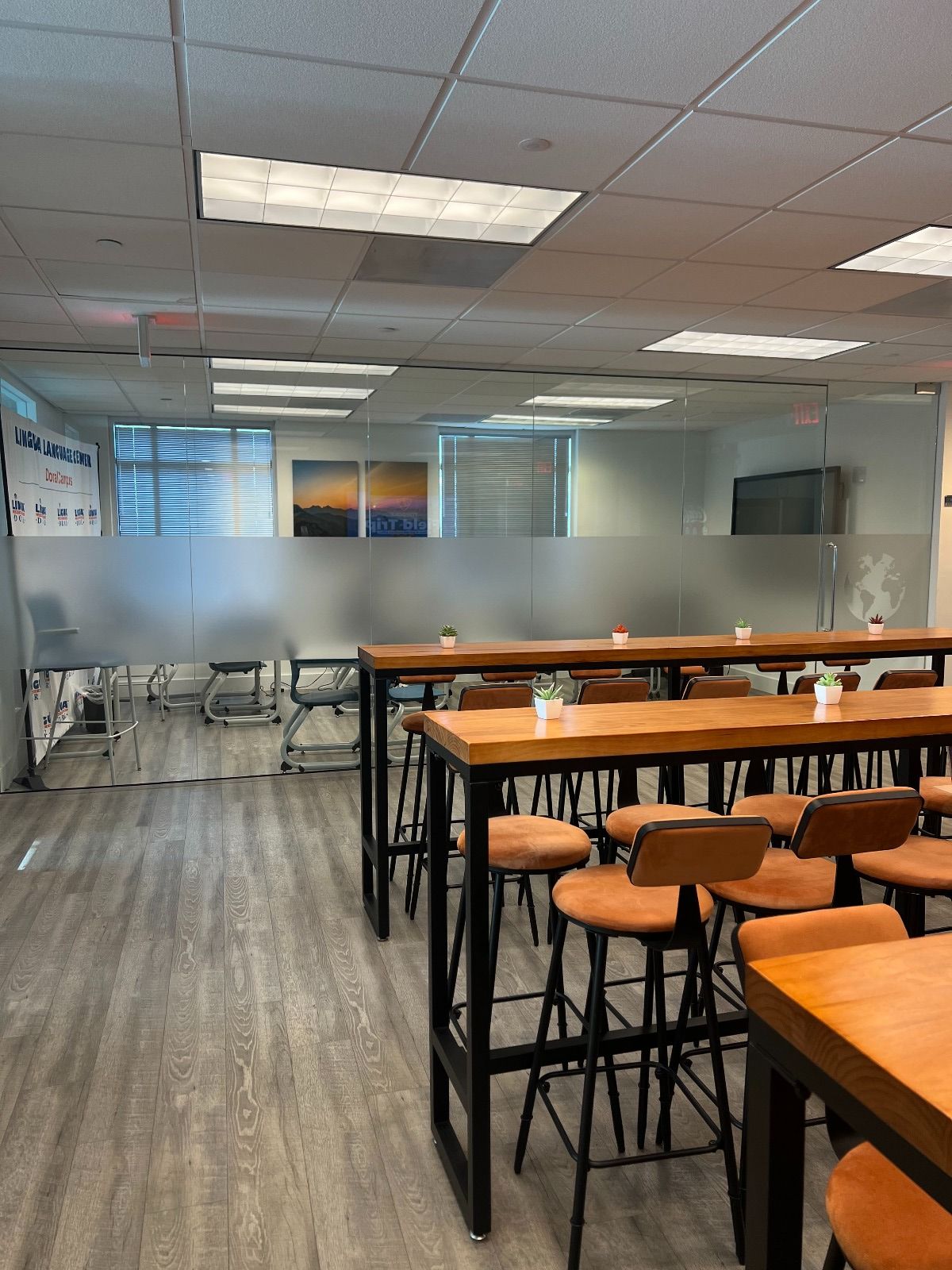 A large room with tables and chairs in it