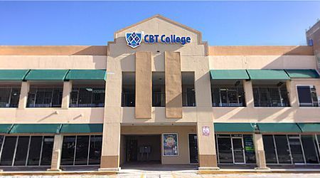CBT College building entrance with beige facade and blue signage under a clear sky