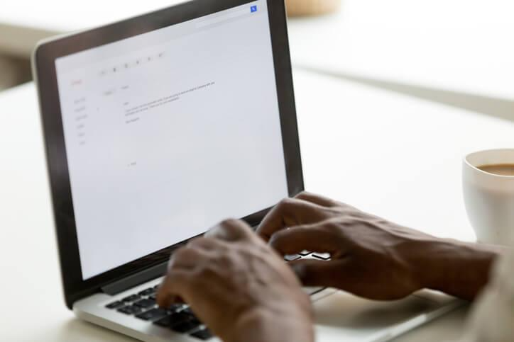 A business professional writing a polished email in English