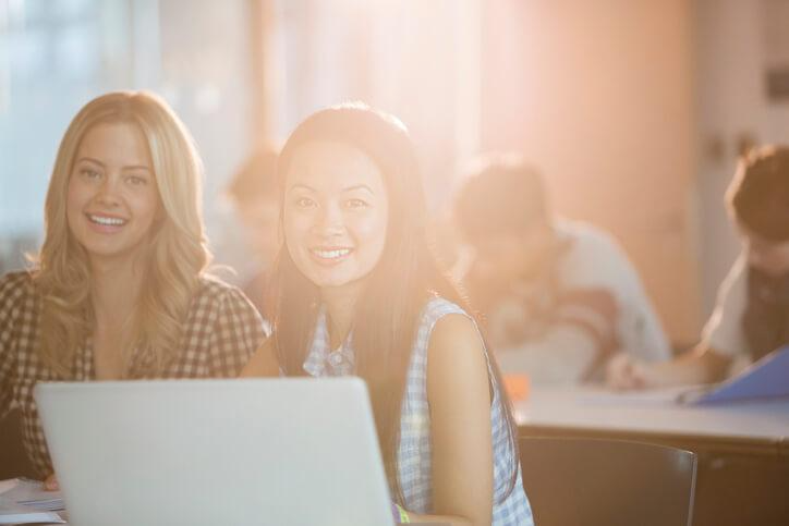 A pair of students learning how to write an email in English at Lingua Language Center